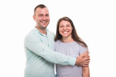Portrait of young happy couple holding each other. Isolated on white background with copyspace advertising area Royalty Free Stock Photo Portrait of young happy couple holding each other. Isolated on white background with copyspace advertising area Royalty Free Stock Photo