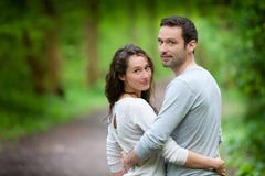 Portrait of a young happy couple in the nature stock images Portrait of a young happy couple in the nature stock images