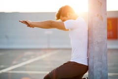 Young man exercising outdoors royalty free stock photos Young man exercising outdoors royalty free stock photos