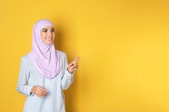 Portrait of young Muslim woman in hijab against color background royalty free stock images Portrait of young Muslim woman in hijab against color background royalty free stock images