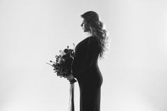 Portrait of young pregnant woman with big flower in her hand. royalty free stock photography Portrait of young pregnant woman with big flower in her hand. royalty free stock photography