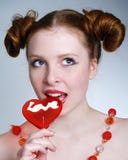 Portrait of young pretty girl holding a lollipop stock photos Portrait of young pretty girl holding a lollipop stock photos