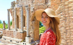 Portrait of young smiling woman with hat in famous Taormina Greek Theatre, Sicily, Italy stock images Portrait of young smiling woman with hat in famous Taormina Greek Theatre, Sicily, Italy stock images