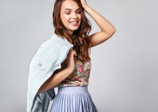 Woman in casual summer clothes with natural makeup posing in studio royalty free stock image Woman in casual summer clothes with natural makeup posing in studio royalty free stock image
