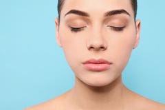 Portrait of young woman with beautiful face and natural makeup on color background, closeup royalty free stock photos Portrait of young woman with beautiful face and natural makeup on color background, closeup royalty free stock photos