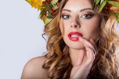 Portraiture style fashion beautiful girl with red hair fall with a wreath of colored leaves and mountain ash color bright tre royalty free stock photography Portraiture style fashion beautiful girl with red hair fall with a wreath of colored leaves and mountain ash color bright tre royalty free stock photography