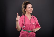 Portret atrakcyjna damy lekarka ono mierzy pokazuje lik zdjęcia stock Portret atrakcyjna damy lekarka ono mierzy pokazuje lik zdjęcia stock