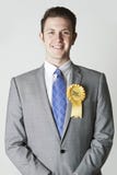 Portret van Liberale Democraatpoliticus Wearing Yellow Rosette royalty-vrije stock foto's Portret van Liberale Democraatpoliticus Wearing Yellow Rosette royalty-vrije stock foto's