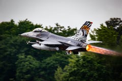 Portuguese Air Force F-16 fighter jet taking off with afterburner from Mont-de-Marsan airbase during the NATO Tigermeet. Mont-De-