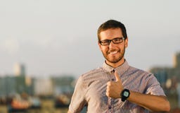 Positive professional man doing thumbs up gesture Royalty Free Stock Photo Positive professional man doing thumbs up gesture Royalty Free Stock Photo