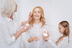 Positive Women Using Beauty Creams Royalty Free Stock Photos