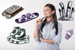 Positiver lächelnder Student beim Denken an Winterurlaube lizenzfreie stockfotos Positiver lächelnder Student beim Denken an Winterurlaube lizenzfreie stockfotos