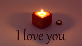 Postcard heart shaped candle with gold ring on Valentine`s day. Greeting card on March 8, Valentine's day, happy women's royalty free stock image Postcard heart shaped candle with gold ring on Valentine`s day. Greeting card on March 8, Valentine's day, happy women's royalty free stock image