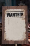 Image of a sign where you can read the word wanted