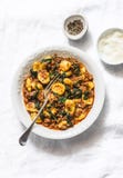 Potato turmeric gnocchi with bolognese sauce and spinach on a light background, top view stock image Potato turmeric gnocchi with bolognese sauce and spinach on a light background, top view stock image