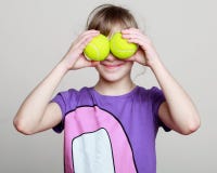 Potrtrait of a little girl with tennis balls instead eyes royalty free stock photos Potrtrait of a little girl with tennis balls instead eyes royalty free stock photos