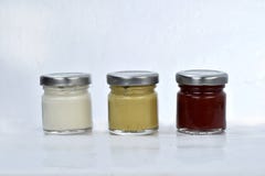Pots with mayonnaise mustard and ketchup on white background stock photos Pots with mayonnaise mustard and ketchup on white background stock photos