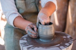 Potter is creating earthenware on potter`s wheel. royalty free stock photography Potter is creating earthenware on potter`s wheel. royalty free stock photography