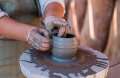 Potter is creating earthenware on potter`s wheel. royalty free stock images Potter is creating earthenware on potter`s wheel. royalty free stock images