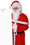 Pouces de Santa Claus sur Noël tenant la bannière vide avec la cannette de fil Image stock Pouces de Santa Claus sur Noël tenant la bannière vide avec la cannette de fil Image stock