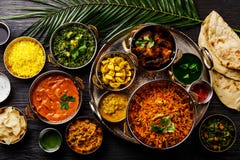 Poulet indien de beurre de cari de nourriture, Palak Paneer, Chiken Tikka, Biryani, cari végétal, Papad, dal, Palak Sabji, Jira A images libres de droits Poulet indien de beurre de cari de nourriture, Palak Paneer, Chiken Tikka, Biryani, cari végétal, Papad, dal, Palak Sabji, Jira A images libres de droits