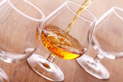 Pouring Cognac Into The Glass Stock Images