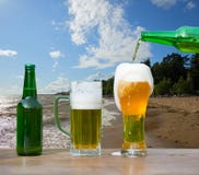 Pouring glass of beer from bottle royalty free stock photos Pouring glass of beer from bottle royalty free stock photos