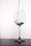 Pouring water to wine glass royalty free stock photos Pouring water to wine glass royalty free stock photos