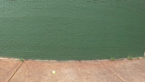 POV of person playing wall tennis