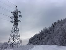 Power line along snow mountain road royalty free stock photos Power line along snow mountain road royalty free stock photos