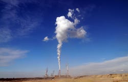 The power plant is located next to the opencast brown coal mine. stock image The power plant is located next to the opencast brown coal mine. stock image