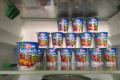 PRAGUE, CZECH REPUBLIC - JULY 100, 2018: yogurt Jogobella with different fruit fillings on the shelf of a home refrigerator stock images PRAGUE, CZECH REPUBLIC - JULY 100, 2018: yogurt Jogobella with different fruit fillings on the shelf of a home refrigerator stock images