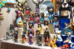 PRAGUE, CZECH REPUBLIC - Oct 24 2015: Showcase gift shop with Souvenirs and funny coloured figures of girls, cats, clay and wooden royalty free stock photo PRAGUE, CZECH REPUBLIC - Oct 24 2015: Showcase gift shop with Souvenirs and funny coloured figures of girls, cats, clay and wooden royalty free stock photo