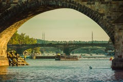 Prague, Czech Republic - September , 17, 2019: Tourists walking trought Charles Bridge, view from Vltava river level stock photos Prague, Czech Republic - September , 17, 2019: Tourists walking trought Charles Bridge, view from Vltava river level stock photos