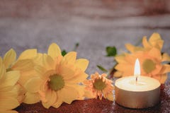 Prayer and hope concept. Retro candle light and yellow flower with lighting effect and glitter abstract background with bokeh defo royalty free stock images Prayer and hope concept. Retro candle light and yellow flower with lighting effect and glitter abstract background with bokeh defo royalty free stock images