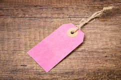 Precio de papel rosado en blanco de la etiqueta foto de archivo libre de regalías Precio de papel rosado en blanco de la etiqueta foto de archivo libre de regalías