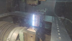Precision cutting of metal parts using an electrical discharge machine