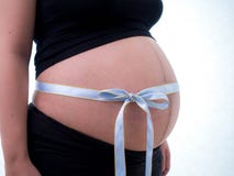Pregnancy with a bow tie stock photography Pregnancy with a bow tie stock photography