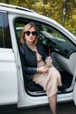 Pregnancy, maternity and happiness. Stylish young pregnant female having rest her car, sitting in white car. Beautiful woman stock photos Pregnancy, maternity and happiness. Stylish young pregnant female having rest her car, sitting in white car. Beautiful woman stock photos