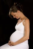 Pregnant Girl Against Black Background 2 Stock Image