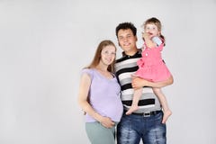 Pregnant Mother, Happy Father And Daughter Royalty Free Stock Photos