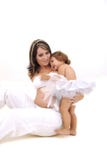 Pregnant Topless Mother Playing With Her Infant Stock Image