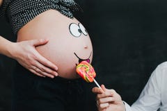 Pregnant wife with husband. Man touching belly of pregnant woman. Family waiting for baby. stock photos Pregnant wife with husband. Man touching belly of pregnant woman. Family waiting for baby. stock photos