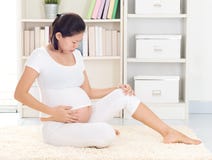 Pregnant Woman with cramp leg Royalty Free Stock Photos