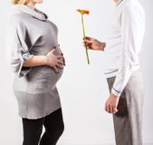 Pregnant woman and her husband isolated on white royalty free stock photos Pregnant woman and her husband isolated on white royalty free stock photos
