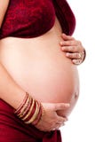 Pregnant woman holding belly Royalty Free Stock Images
