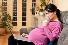 Pregnant woman with laptop