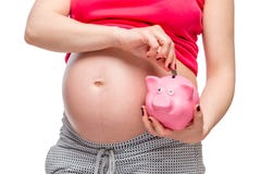pregnant woman lays money in piggy bank, belly close-up stock images pregnant woman lays money in piggy bank, belly close-up stock images