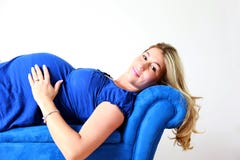 Pregnant Woman Resting On Couch Royalty Free Stock Photos