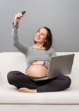 Pregnant woman take a picture stock photos Pregnant woman take a picture stock photos